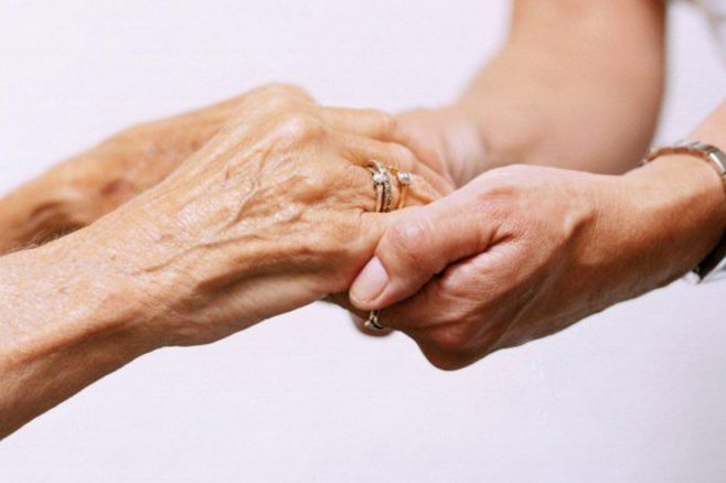 Grandma holding hands. alert1 medical alert systems